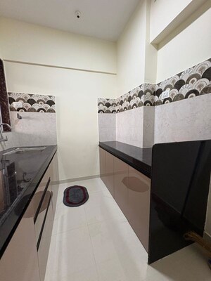 Kitchen in 2 BHK Apartment at Vedant Sumeet Elite, Balkum Pada – for Rent