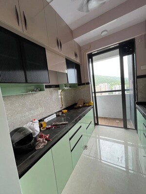 Kitchen in 2.5 BHK Apartment at Shree Satya Shankar Residency, Manpada – for Rent