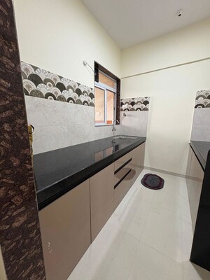 Kitchen in 2 BHK Apartment at Dhamji Shamji Mahavir Spring Tulip Phase 1, Pokhran Road No Two – for Rent