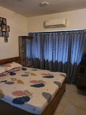 Bedroom in 2 BHK Apartment at K Raheja Heights, Malad East – for Rent