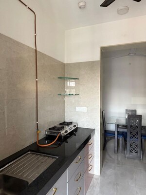Kitchen in 2 BHK Apartment at Sheth Vasant Oasis, Andheri East – for Rent