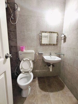 Bathroom in 3 BHK Apartment at Kolte Patil Margosa Heights, Mohammadwadi – for Rent