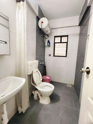 Bathroom in 3 BHK Apartment at Kolte Patil Margosa Heights, Mohammadwadi – for Rent