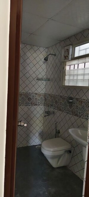 Bathroom in 3 BHK Apartment at Vs Raintree, Halasuru – for Sale