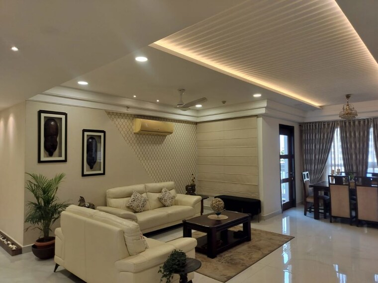 Living Room, universal-botanika-tower-a-and-b 4 Bedroom 4012 Sq.Ft. Apartment In Gachibowli Hyderabad 10620591