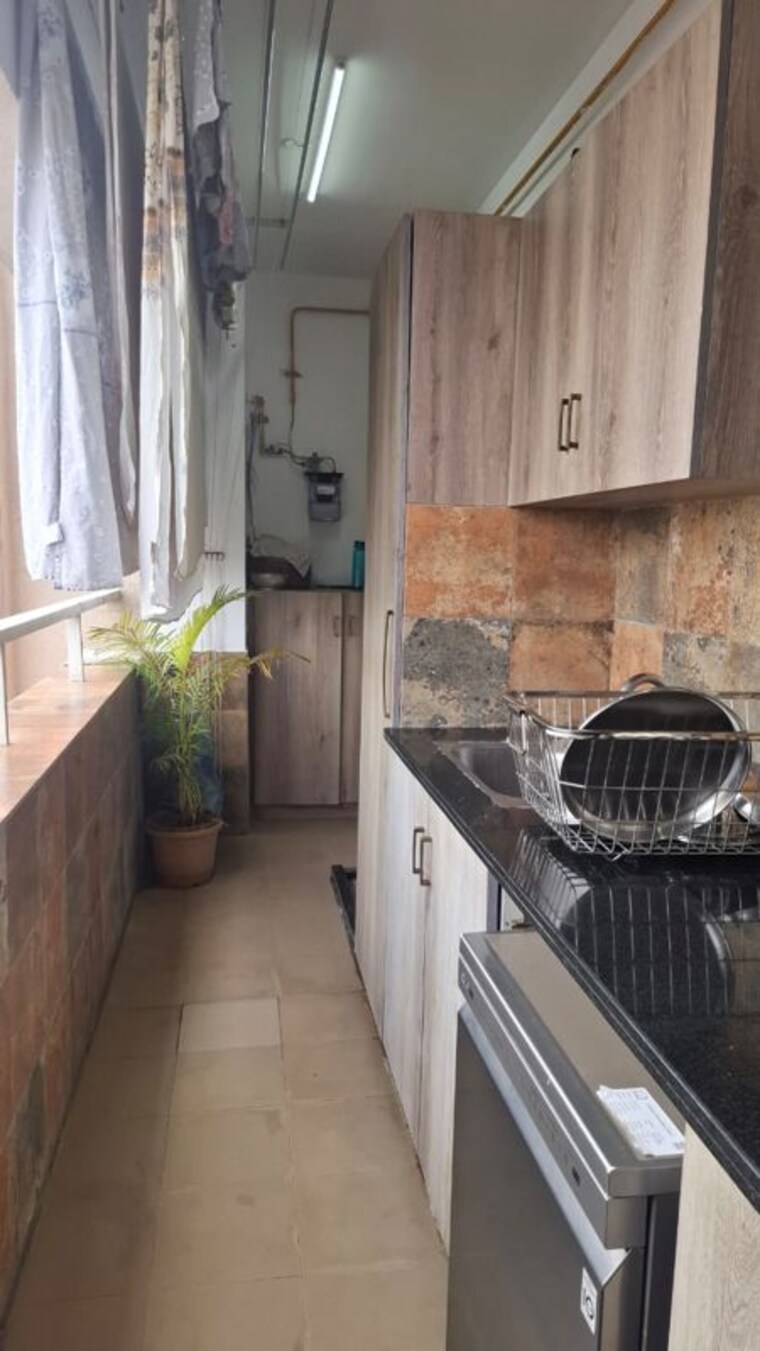 Kitchen, universal-botanika-tower-a-and-b 4 Bedroom 4012 Sq.Ft. Apartment In Gachibowli Hyderabad 10620591