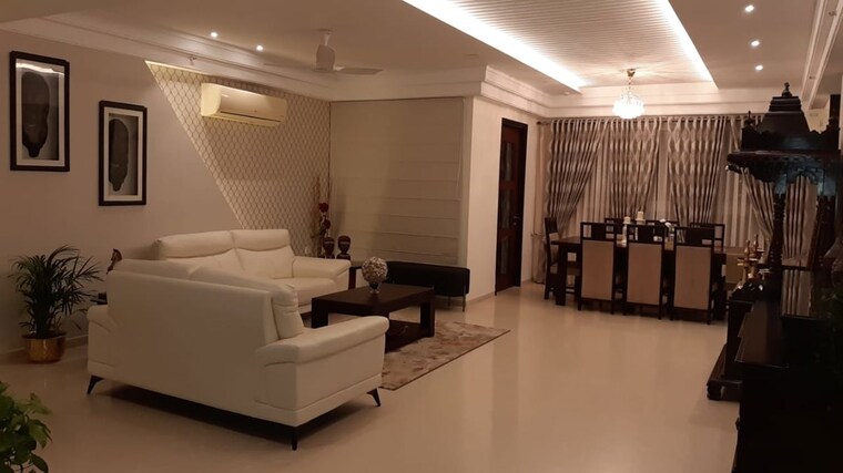 Living Room, universal-botanika-tower-a-and-b 4 Bedroom 4012 Sq.Ft. Apartment In Gachibowli Hyderabad 10620591