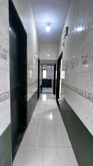 Building Lobby in 2 BHK Apartment at Amritvan Complex, Aarey Colony – for Sale