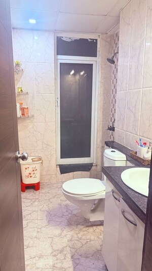Bathroom in 3 BHK Apartment at Mahagun Mirabella, Sector 79 – for Rent