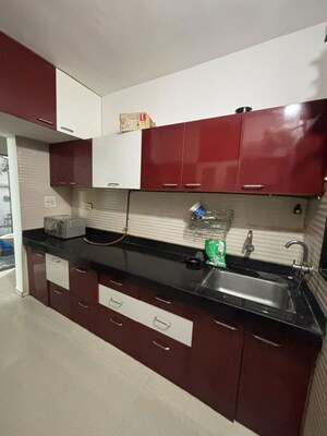 Kitchen in 2.5 BHK Apartment at Cosmos Jewels, Ghodbunder Road – for Rent