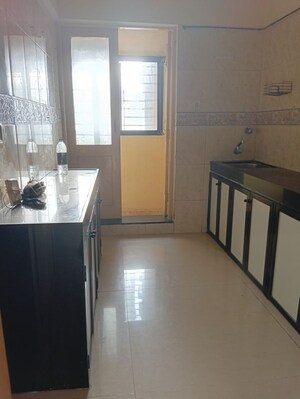 Kitchen in 2 BHK Apartment at K Raheja Palm Court, Malad West – for Rent