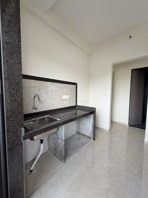 Kitchen in 3 BHK Apartment at Damji Shamji Mahavir Spring Tulip Phase 1, Pokhran Road No Two – for Rent