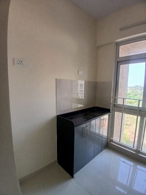 Kitchen in 1 BHK Apartment at Metropolis Bayside, Kasarvadavali – for Rent