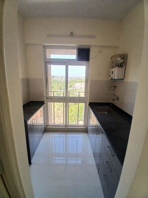 Kitchen in 1 BHK Apartment at Pushpanjali Heights, Owale – for Rent