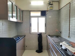 Kitchen in 1 BHK Apartment at Paradigm ZENITH, Ghodbunder Road – for Sale