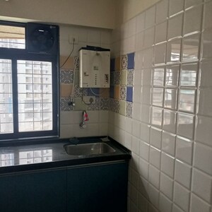 Kitchen in 1 BHK Apartment at Rosa Classique, Kasarvadavali – for Sale