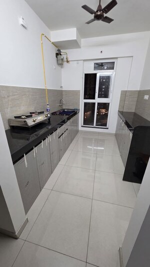 Kitchen in 2 BHK Apartment at Godrej Emerald, Ghodbunder Road – for Rent