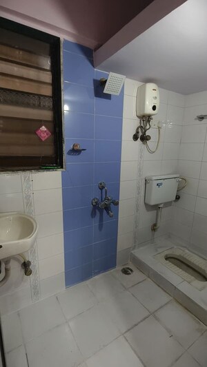 Bathroom in 1 BHK Apartment at Riddhi Garden, Malad East – for Rent
