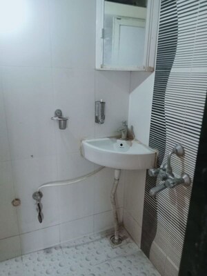 Bathroom in 2 BHK Apartment at Puranik City, Kasarvadavali – for Rent