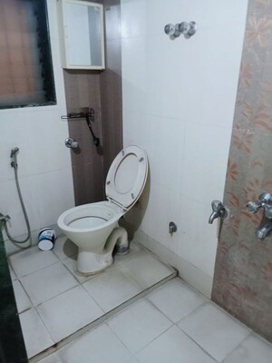 Bathroom in 2 BHK Apartment at Puranik City, Kasarvadavali – for Rent