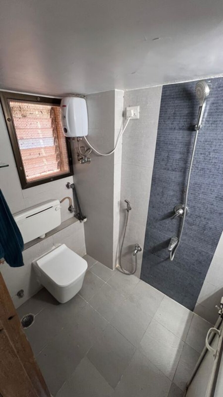 Bathroom, strawberry-sandstone 3 Bedroom 900 Sq.Ft. Apartment In Mira Road Thane 10634151