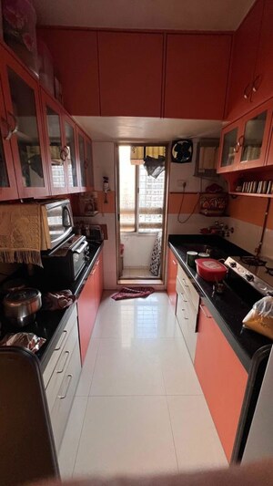 Kitchen in 3 BHK Apartment at Strawberry Sandstone, Mira Road – for Sale