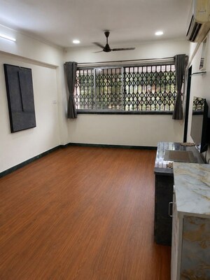 Living Room in 1 BHK Apartment at Bombay Bazar Premise CHS, Santacruz West – for Rent