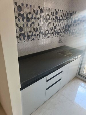 Kitchen in 1 BHK Apartment at Raunak Unnathi Woods Phase 7 A And B, Ghodbunder Road – for Rent
