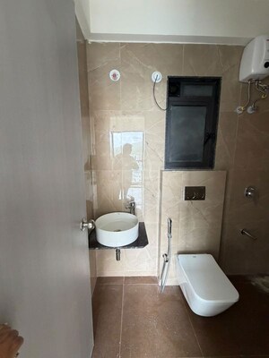 Bathroom in 1 BHK Apartment at Damji Shamji Mahavir Spring Tulip Phase 1, Pokhran Road No Two – for Rent