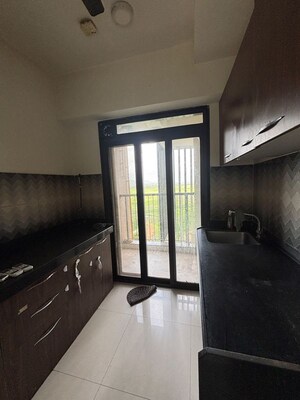 Kitchen in 2 BHK Apartment at Godrej Emerald, Ghodbunder Road – for Rent