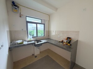 Kitchen in 2 BHK Apartment at Piramal Vaikunth A Class Homes, Balkum Pada – for Rent