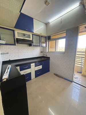 Kitchen in 3 BHK Apartment at Godrej Emerald, Ghodbunder Road – for Rent