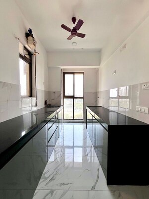 Kitchen in 2 BHK Apartment at Raymond Ten X Habitat, Pokhran Road No Two – for Rent