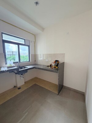 Kitchen in 2 BHK Apartment at Piramal Vaikunth A Class Homes, Balkum Pada – for Rent