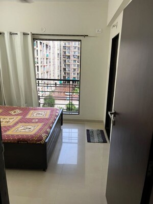 Bedroom in 2 BHK Apartment at Dheeraj Jade Residences, Wagholi – for Rent