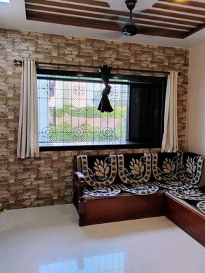 Living Room in 1 BHK Apartment at The Makwana Om Palace, Malad West – for Rent