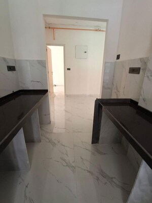Kitchen in 2 BHK Apartment at Ruparel Sky Green, Kandivali West – for Rent