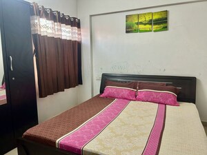 Bedroom in 2 BHK Apartment at Satyam Serenity, Wadgaon Sheri – for Rent