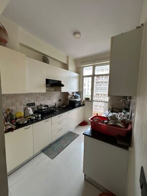 Kitchen in 3 BHK Apartment at Nitishree Aura Chimera, Raj Nagar Extension – for Rent