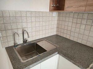 Kitchen in 2 BHK Apartment at Godrej Golf Link Villas, Sector 27 Yamuna Expressway – for Rent