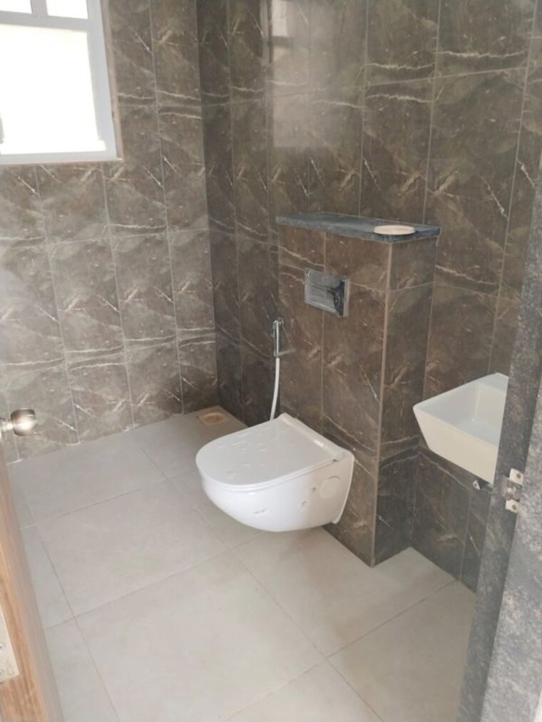 Bathroom, kolte-patil-life-republic-16th-avenue-arezo 2 Bedroom 850 Sq.Ft. Apartment In Hinjewadi Pune 10637509