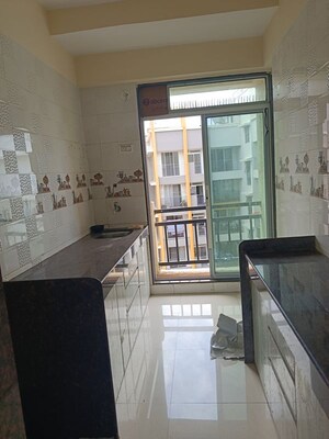 Kitchen in 2 BHK Apartment at Yogiraj CHS, Virar West – for Sale