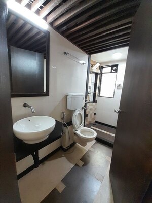 Bathroom in 4 BHK Apartment at Belscot Chs Ltd, Andheri West – for Sale