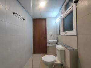 Bathroom in 2 BHK Apartment at Bhartiya Nikoo Homes Phase 2, Thanisandra Main Road – for Rent