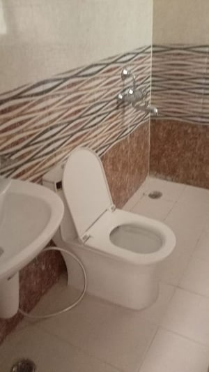 Bathroom in 3 BHK Apartment at Govind Vihar – for Rent