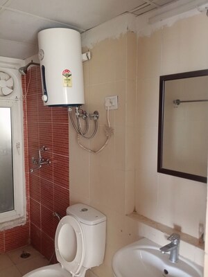 Bathroom in 3 BHK Apartment at Mahagun My Woods, Sector 16c Greater Noida – for Rent