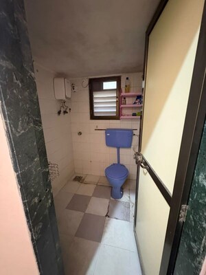 Bathroom in 2 BHK Apartment at Manisha Purti CHS, Goregaon West – for Rent