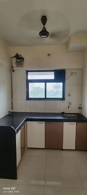 Kitchen in 1 BHK Apartment at Raunak Delight, Owale – for Rent