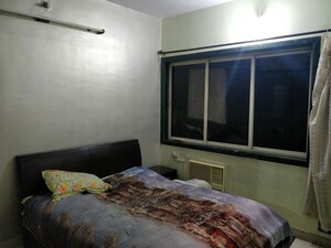Bedroom in 2 BHK Apartment at New Nikita Apartments, Borivali West – for Rent