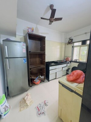 Kitchen in 1 BHK Apartment at Rose Garden CHS, Borivali West – for Rent